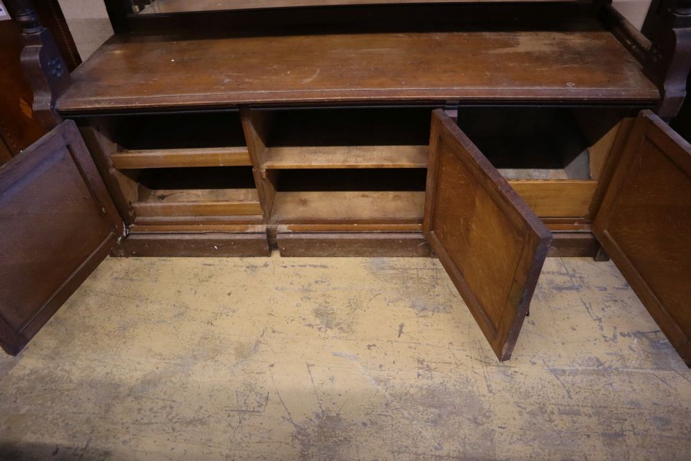 A large late Victorian oak aesthetic movement buffet sideboard, width 183cm depth 58cm height 180cm